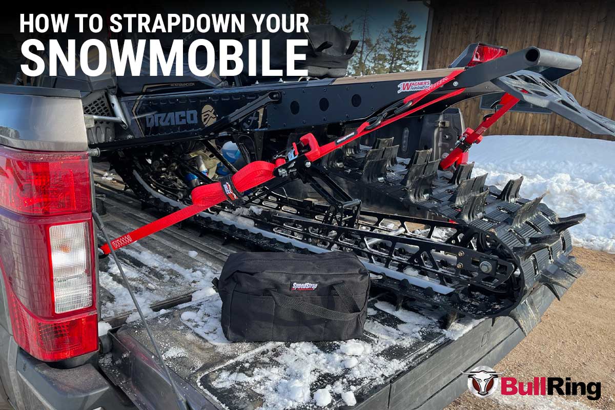 Snowmobile properly secured with speedstrap tie-down straps and bullring anchors